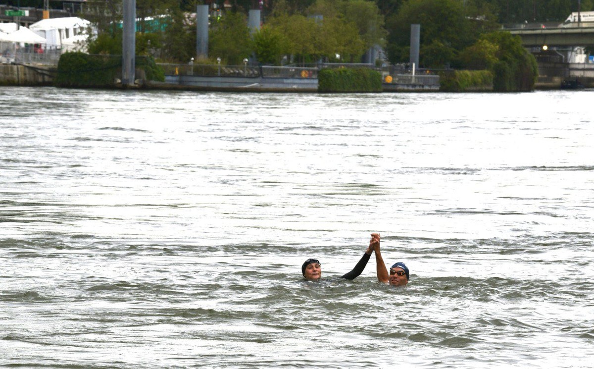 French Sports Minister Takes a Dive into the River Seine | Olympics