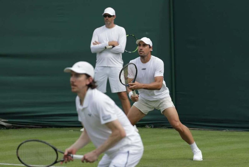 Romboli e Smith treinando em Wimbledon